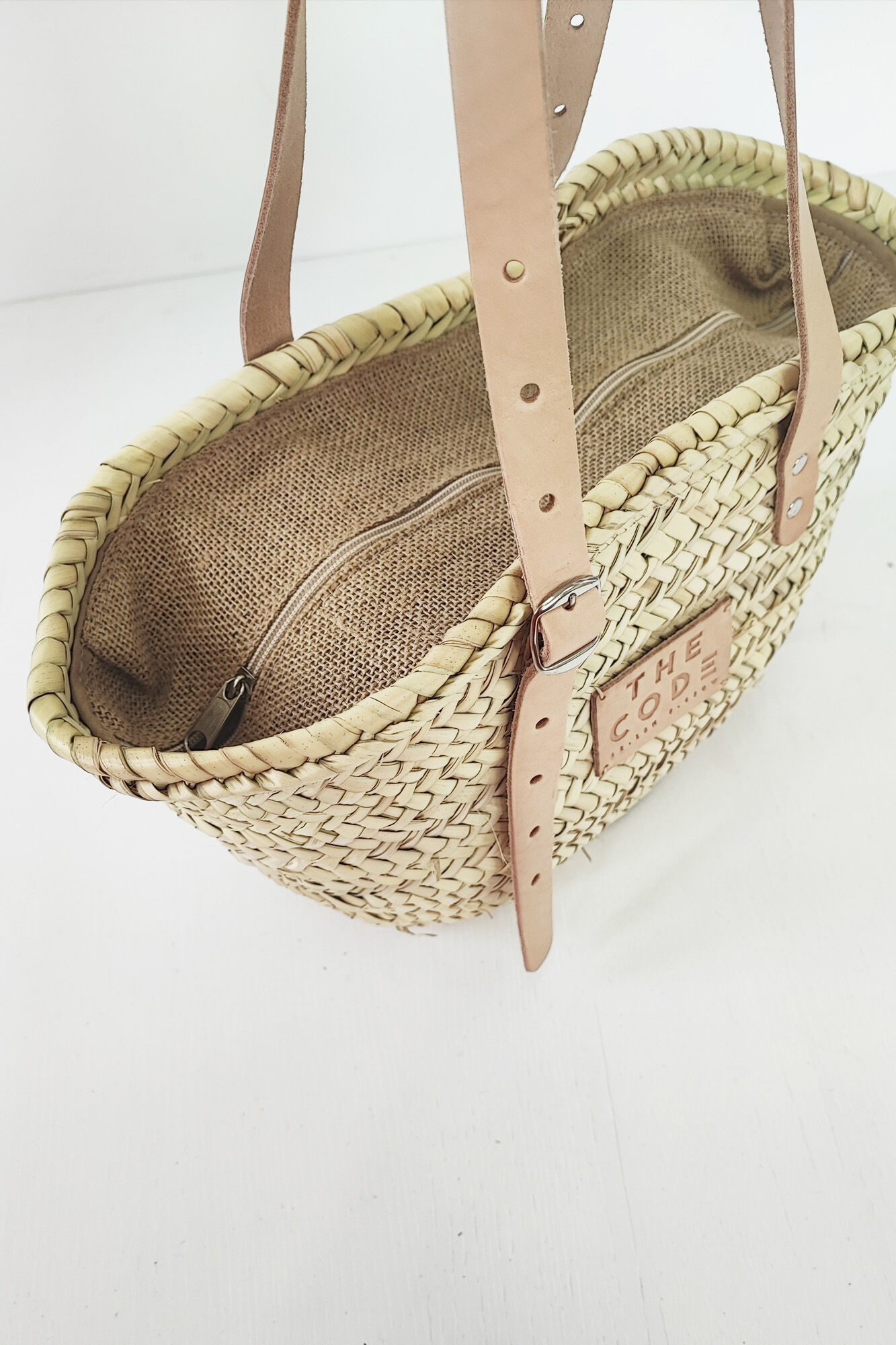 The Code Formentera leather basket bag bag Beige