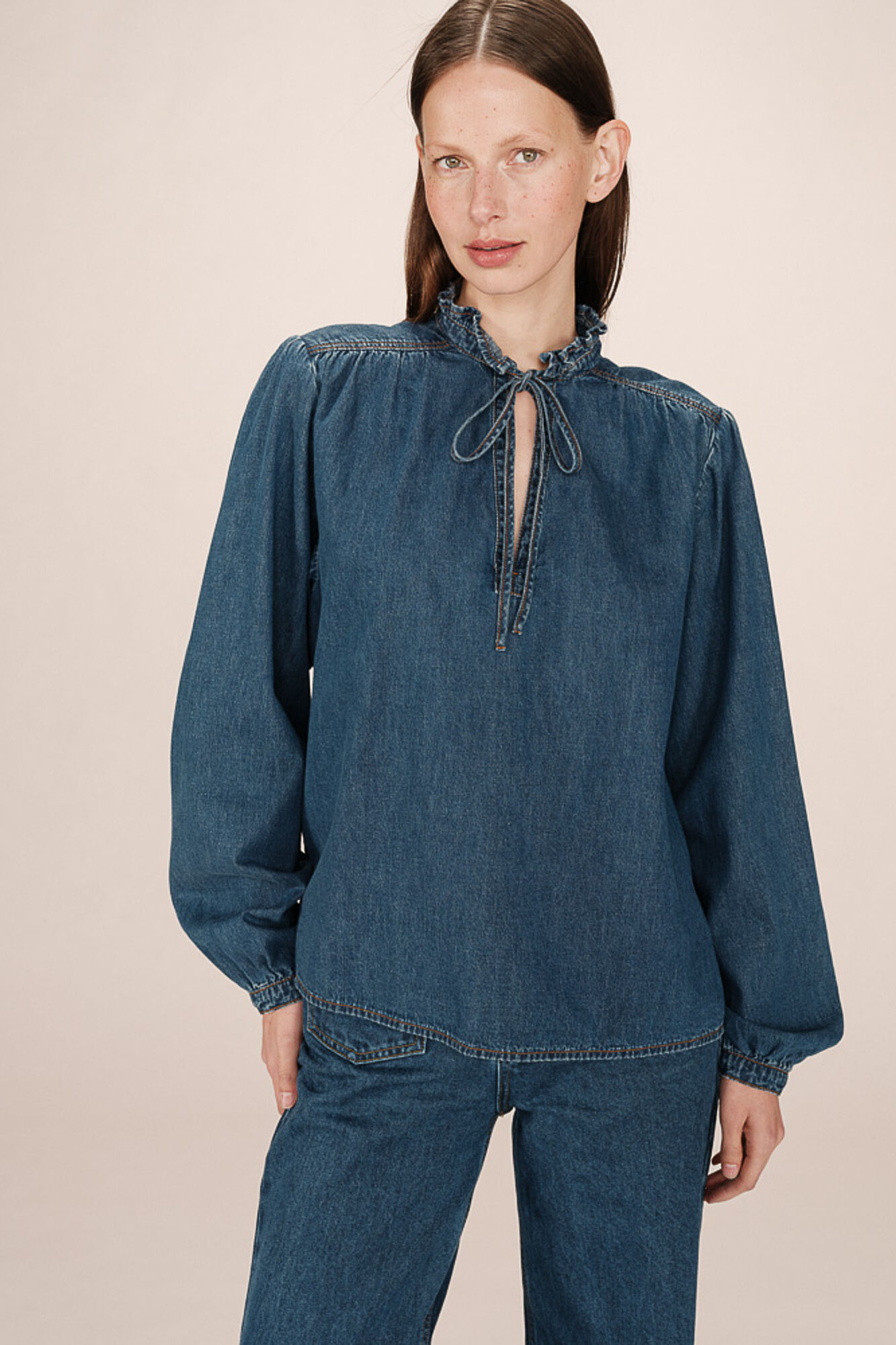 Grace & Mila long sleeve denim blouse with a ruffle and bow or tie detail at the neck Blue